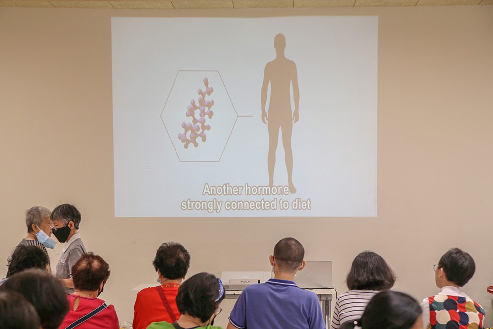 Videos on animal protection and health documentaries are played on repeat at the movie screening zone, making people rethink about meat consumption. (Photo by Fong Kwai Kin)