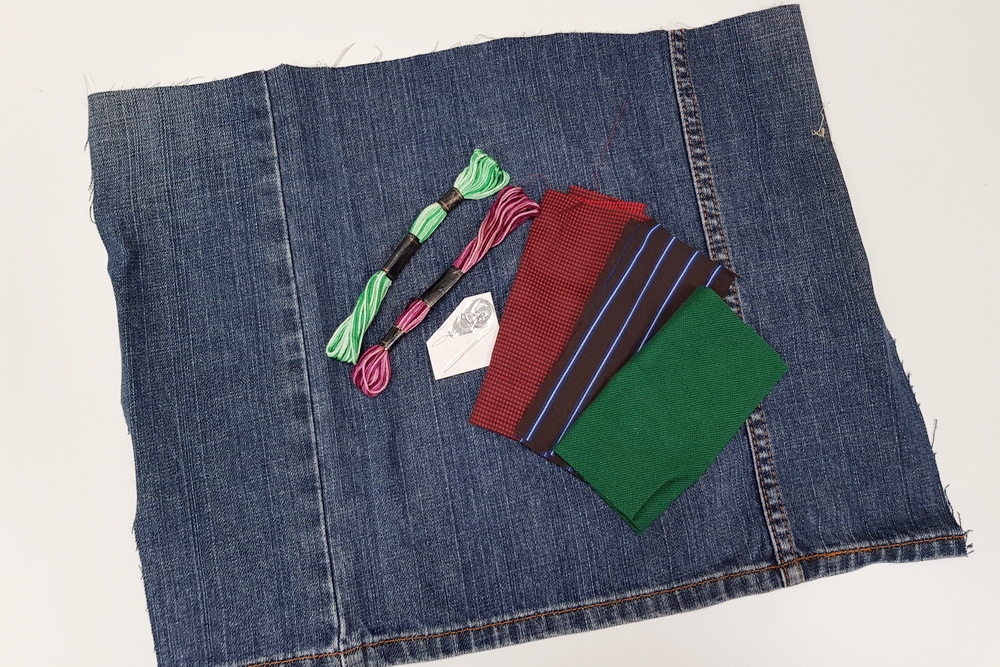 A sewing kit which consists of jeans fabric, floral cloth, needle and thread. (Photo by Chan May Ching)