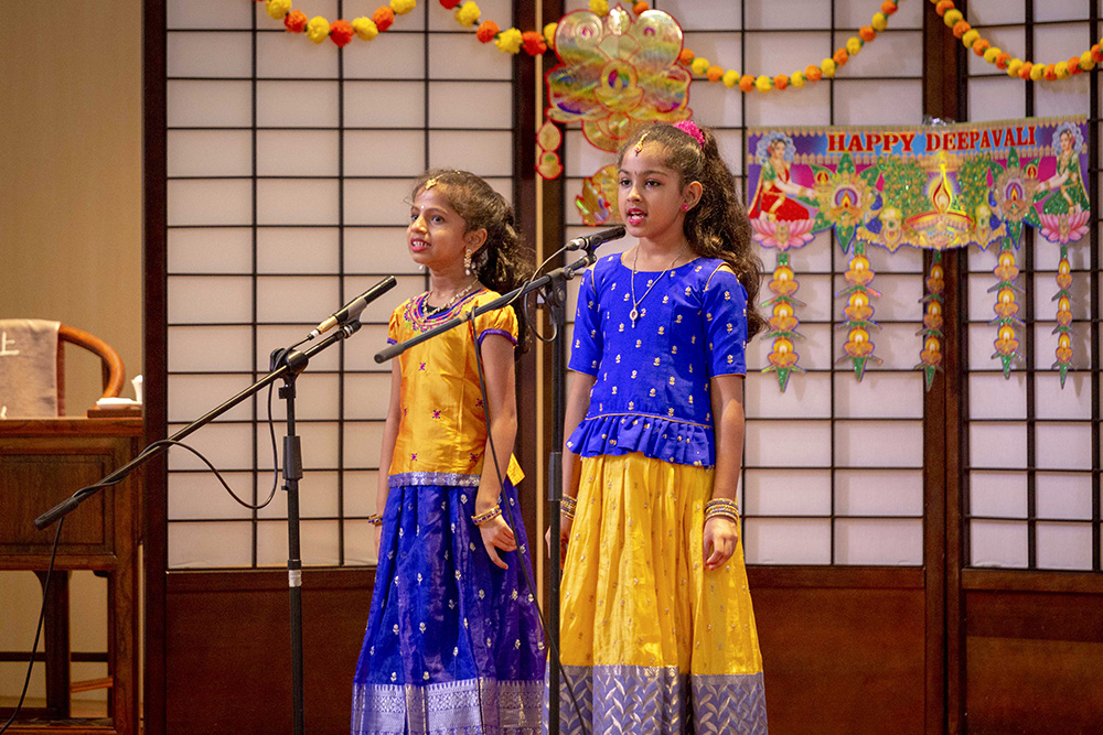 Two little Indian girls are singing Indian songs and receiving many positive comments from the care recipients online. (Photo by Chen Ya Yin)